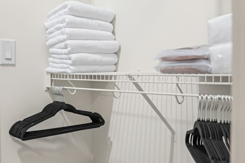 Laundry Room: Enjoy fresh towels and ample hangers for a clutter-free stay!