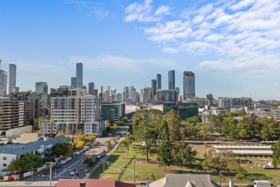 Brisbane CBD skyline rises beyond South Bank near South Brisbane 1BR.