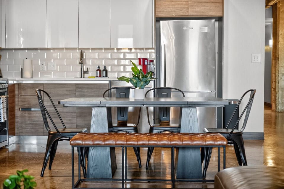 Modern Dining Area – A sleek dining setup with comfortable seating for your group, perfect for meals or game nights.