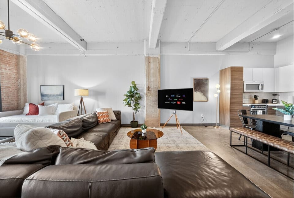 Seamless Flow – Modern kitchen meets cozy living space for a true open-concept experience.