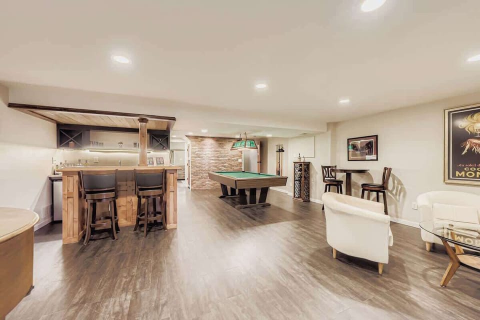 Fun basement hangout featuring a bar and full-size pool table.