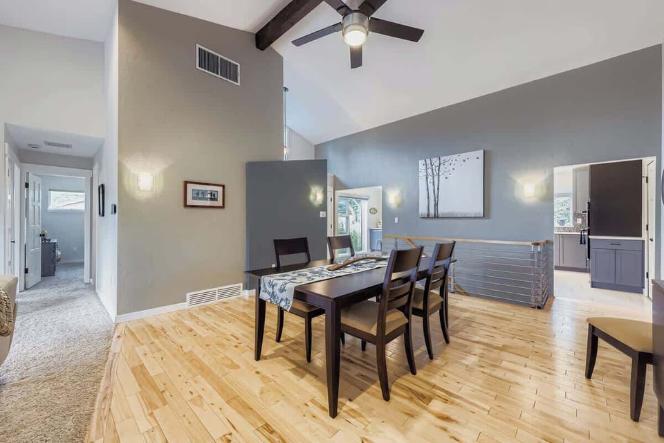Dining table with stylish wall lighting for a warm, inviting atmosphere.