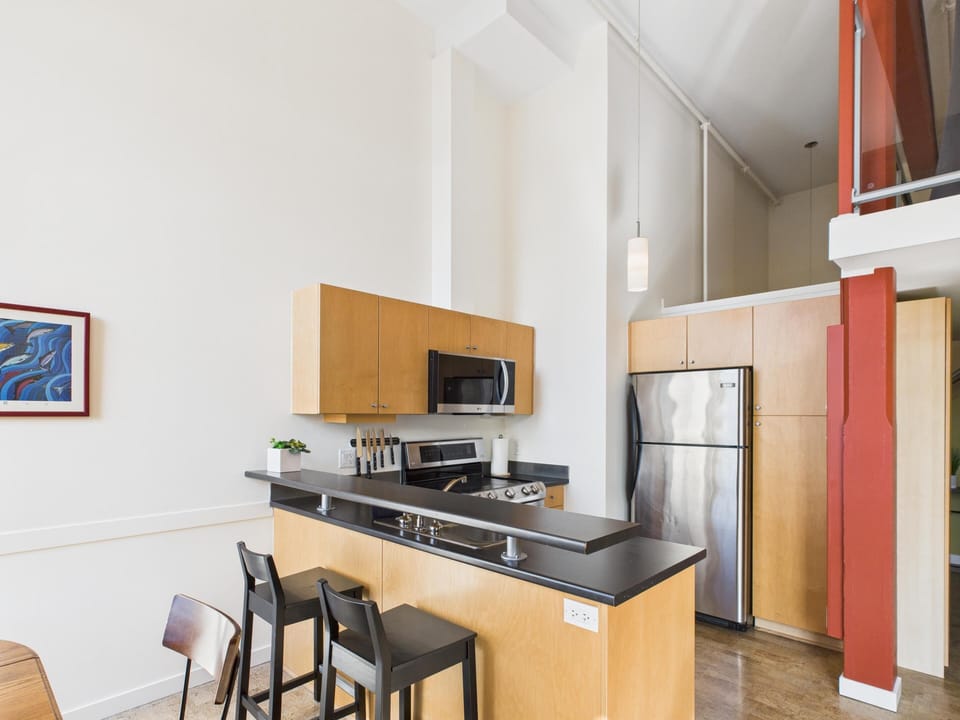 Pull up a stool at the kitchen bar counter—ideal for entertaining guests or enjoying a quick casual bite to eat.