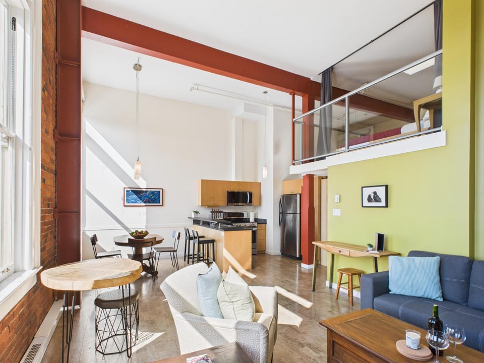 Another vantage point of the stunning main floor, emphasizing the impressive vertical space and architectural character.