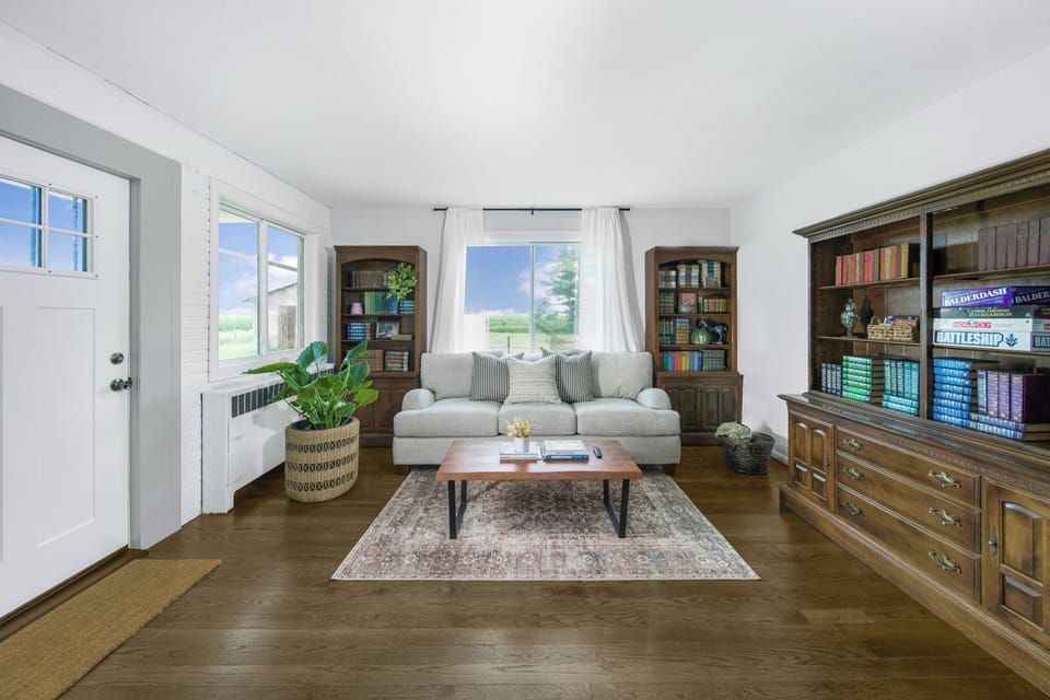 Sunlit living room with games and books to enjoy!