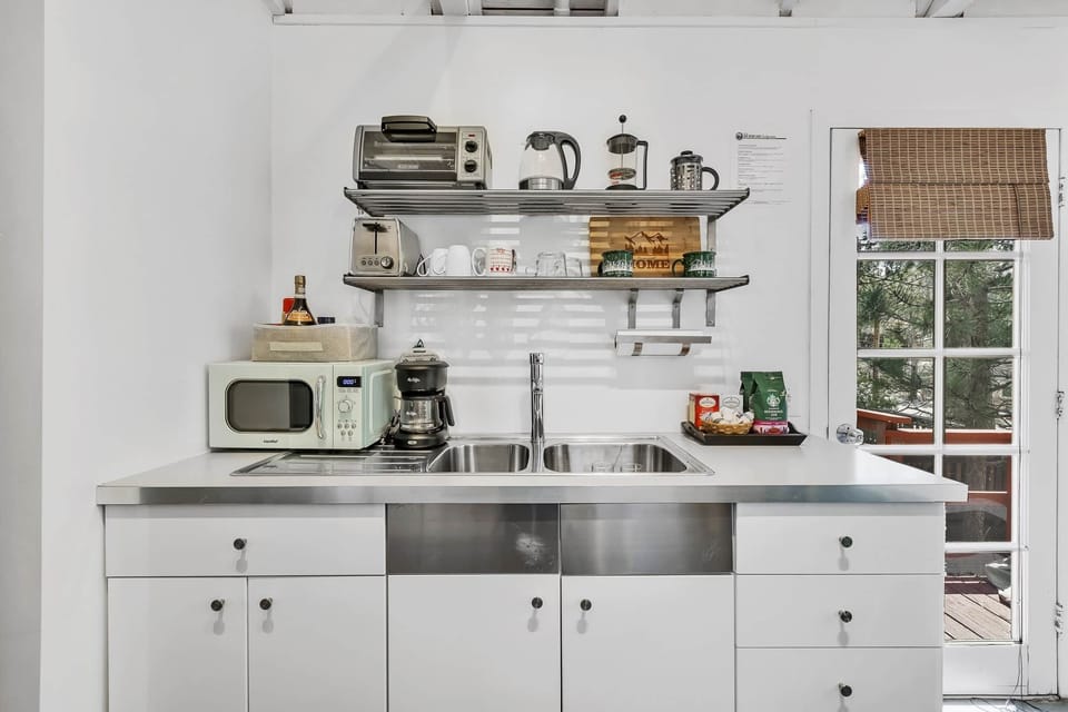 Whip up delicious meals in this bright kitchen with modern appliances and sleek design.