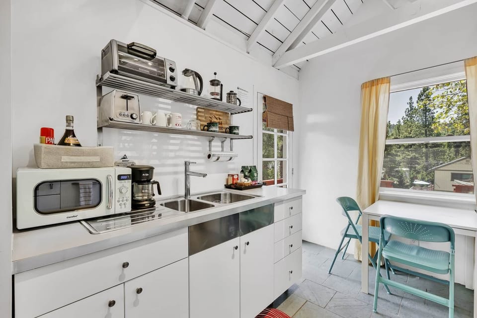 Cook in this sunlit kitchen, equipped with modern appliances, blending style and function effortless