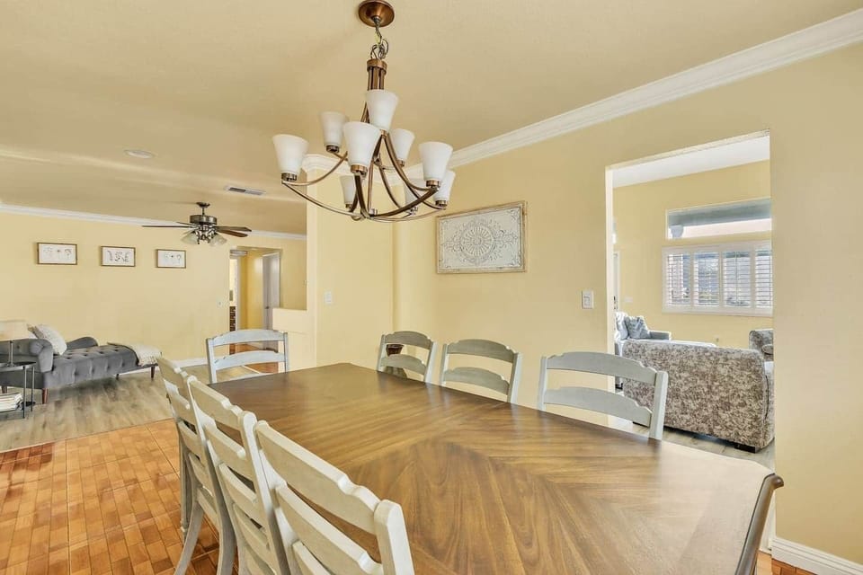 Dining table for eight, ideal for shared meals in a simple, open setting.