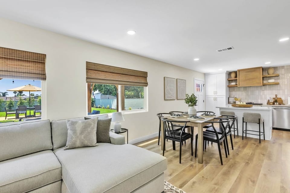 Unwind in our bright, airy living room with a cozy sofa and warm, inviting ambiance.