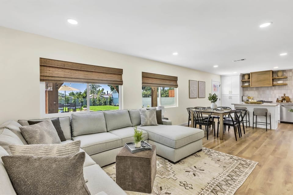 Step into our bright, spacious living room, where comfort meets style in natural light.