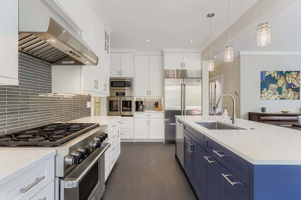A modern kitchen equipped with stainless steel appliances, sleek cabinetry, and ample counter space—perfect for cooking, entertaining, and enjoying a stylish, functional space.