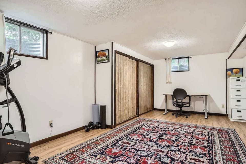 Dedicated Office Space in the basement with workout equipment 