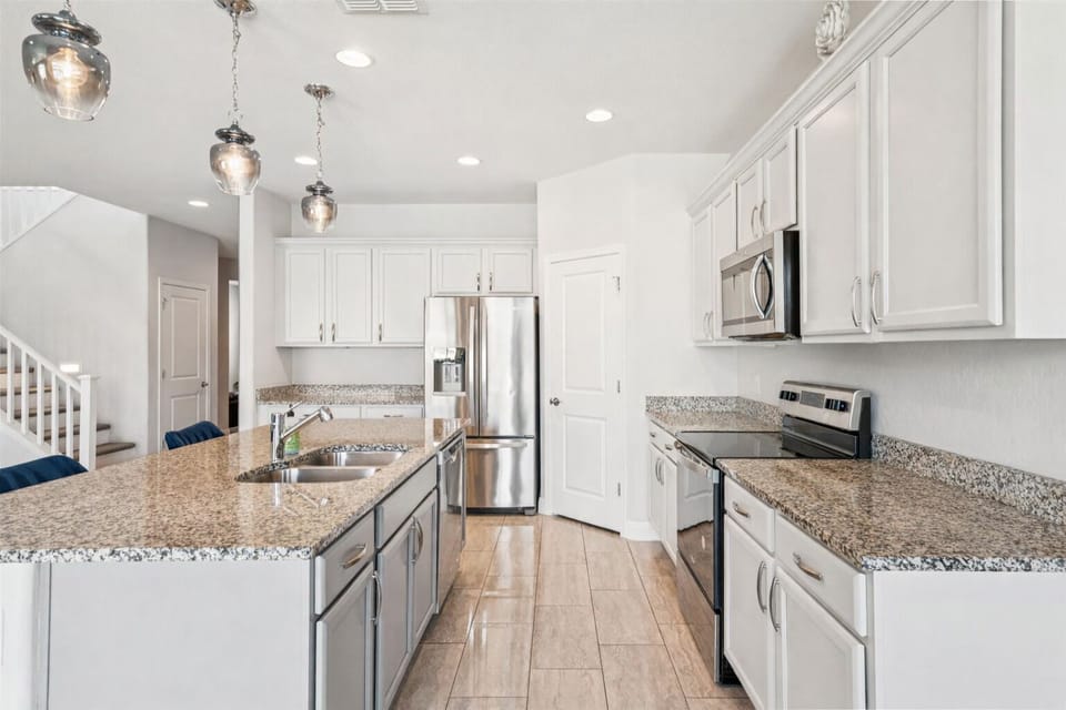 Full-size kitchen with stainless steel appliances. 