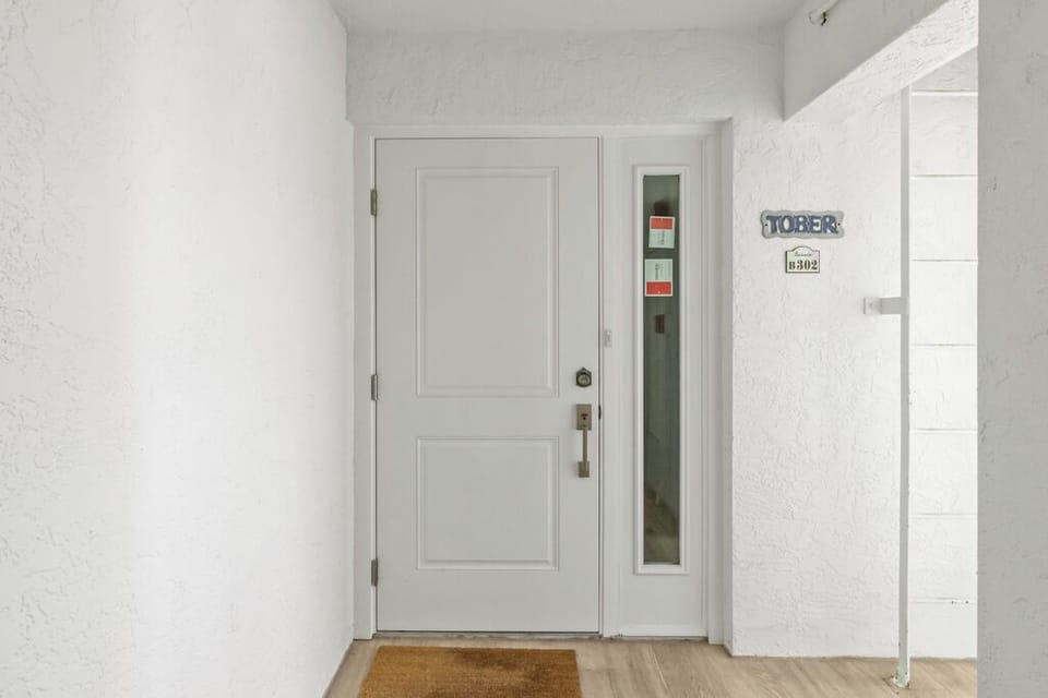 Front door entry, 2 sets of stairs and elevator for access
