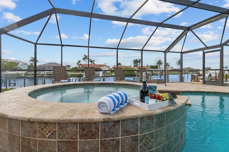 Indulge in pure luxury—sip, soak, and savor the waterfront views from your private oasis.