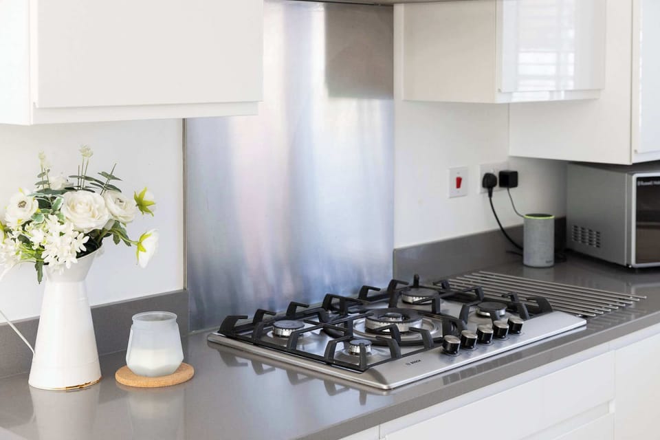 Cook your favourite meals in this sleek and modern kitchen.