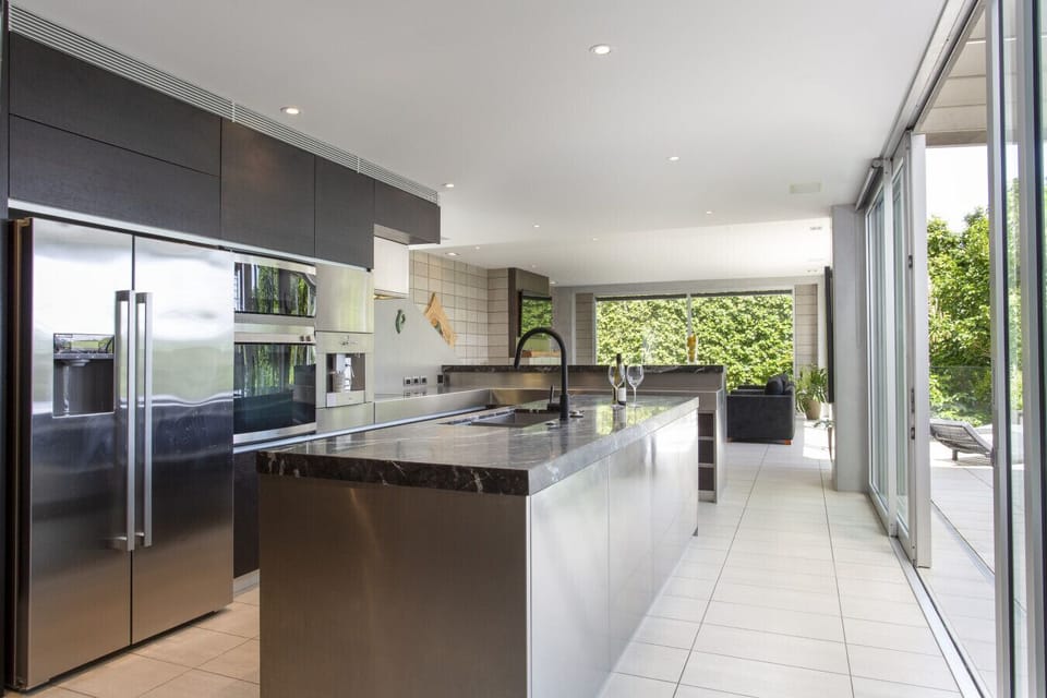 Full kitchen features a built in espresso machine
