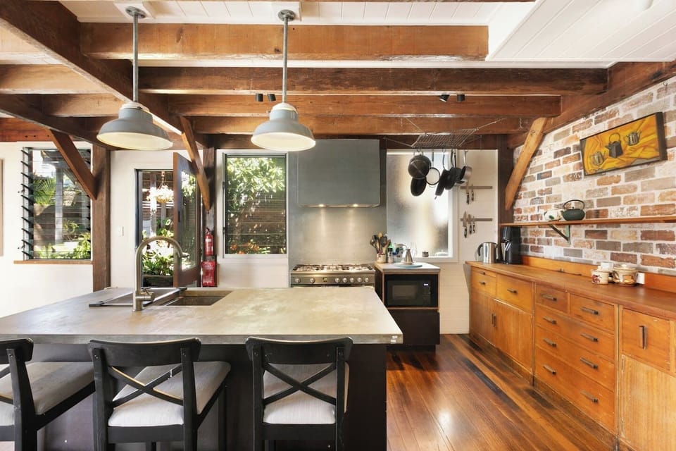 Kitchen | Cook with ease in the spacious kitchen, complete with a generous island and bar seating.