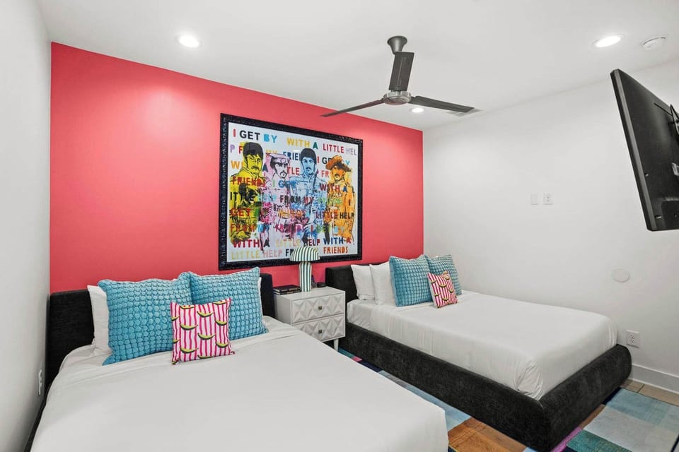 Bedroom 1: Two Queen Beds, Smart TV + Adjacent Full Bathroom
