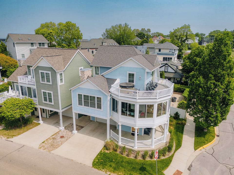Welcome to the B.O.A.T. House, a luxury home with harbor views from 3 levels of porches, topped with a roof top hot tub!