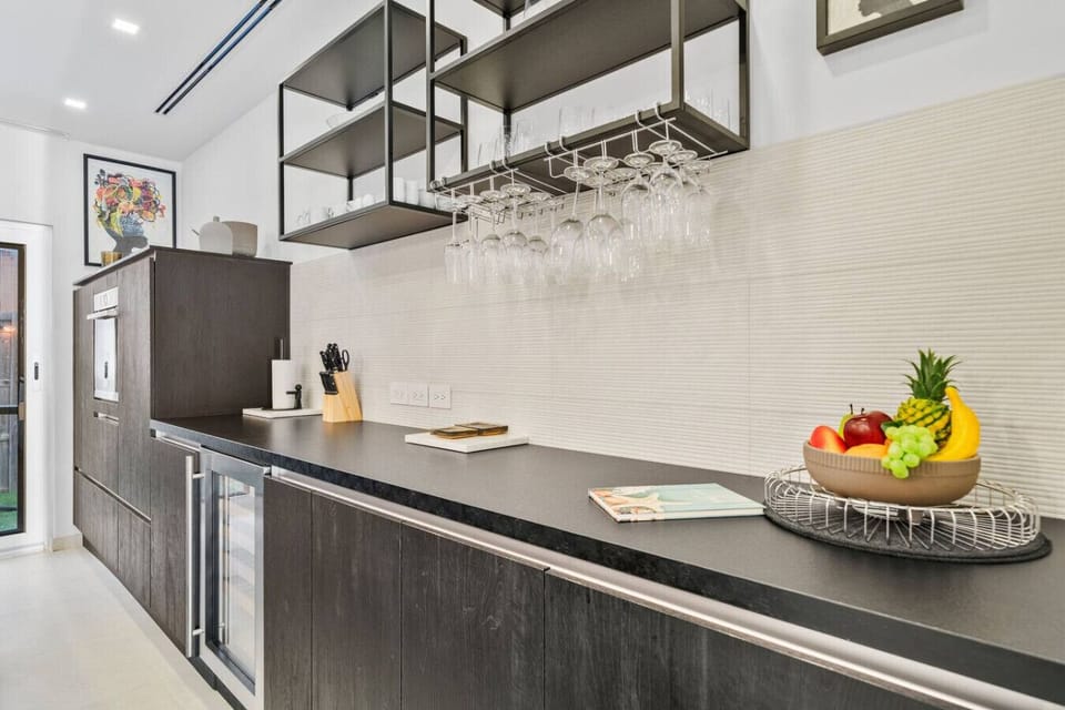 Fully equipped kitchen with modern appliances and bar seating.