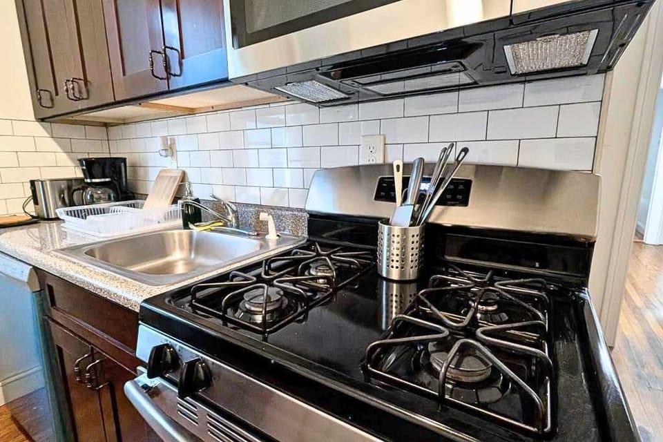 Savor the flavor with a gas range and essentials ready for your favorite recipes—perfect for travelers who love home cooking.