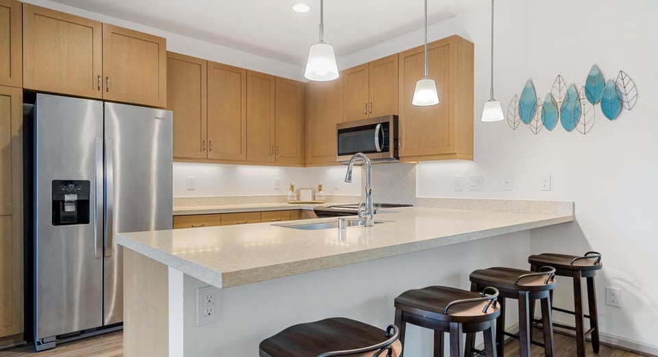 Breakfast bar with seating, ideal for coffee or casual dining.