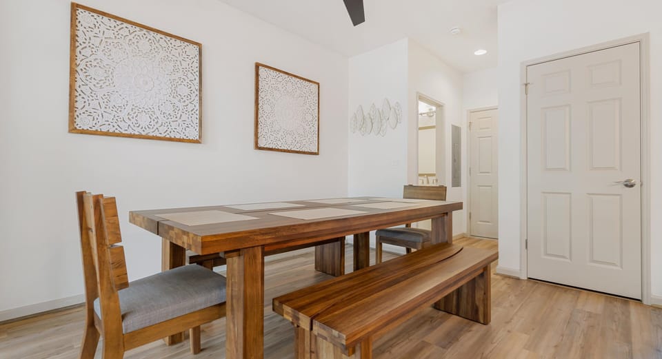 Open dining space with bench seating, designed for easy gathering and conversation.