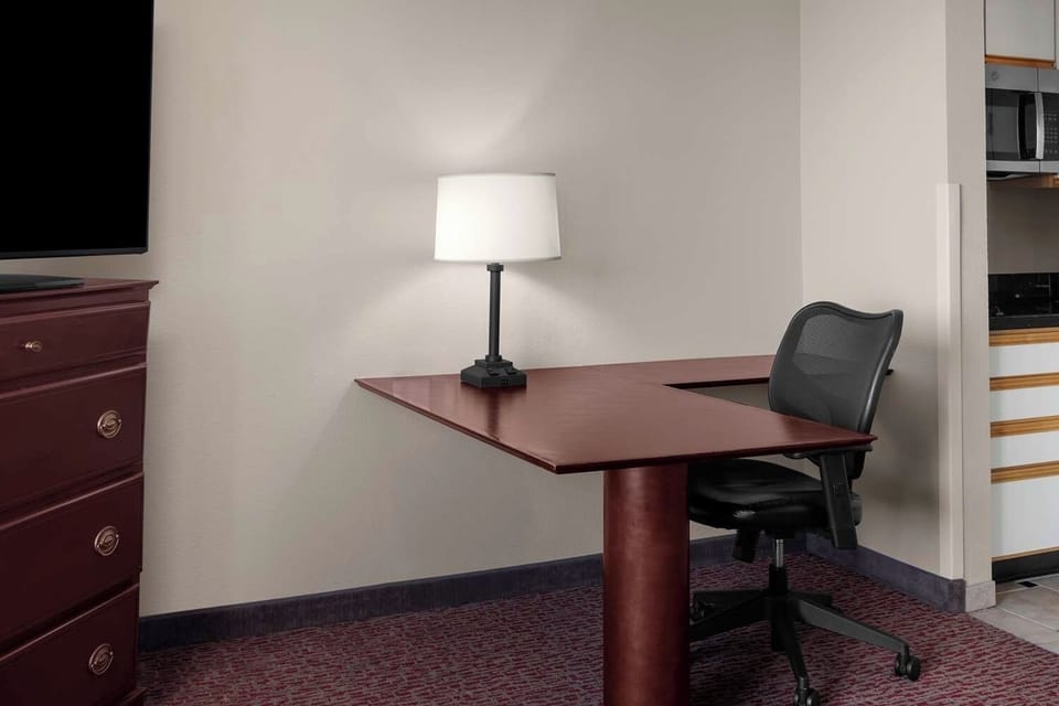 Settle in and focus at a spacious desk and chair.