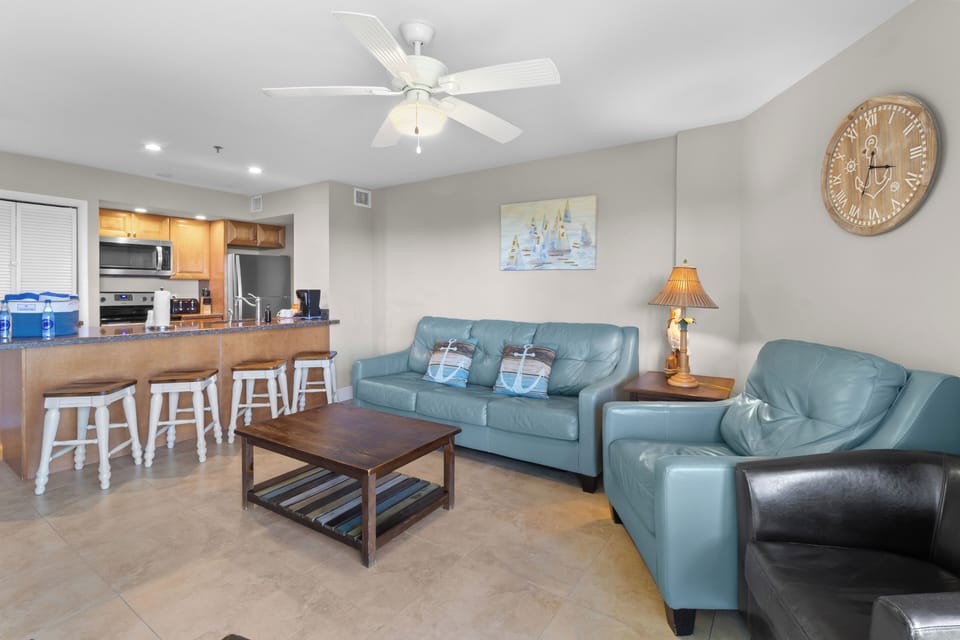 Gather together in the airy living space with breakfast bar.