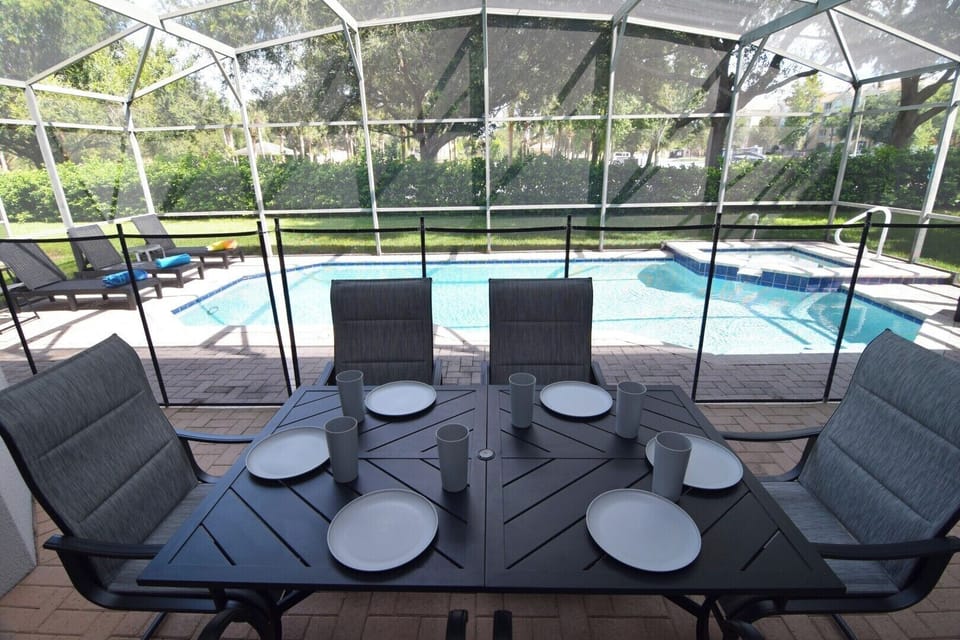 Beautiful private pool deck with loungers and shaded seating area