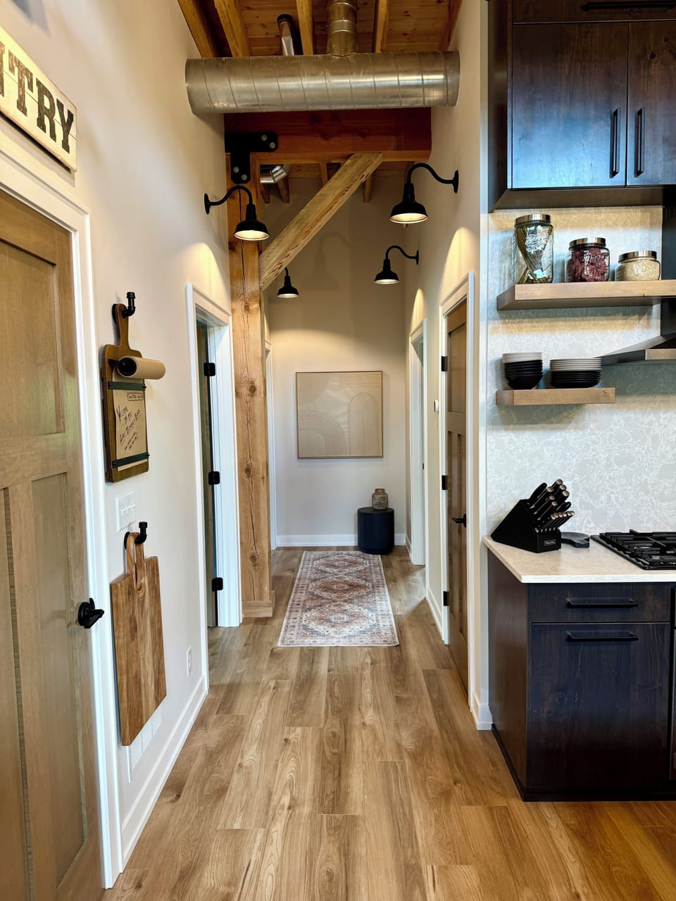 Hallway from kitchen to Bedrooms 2 and 3 as well as Bathroom 2