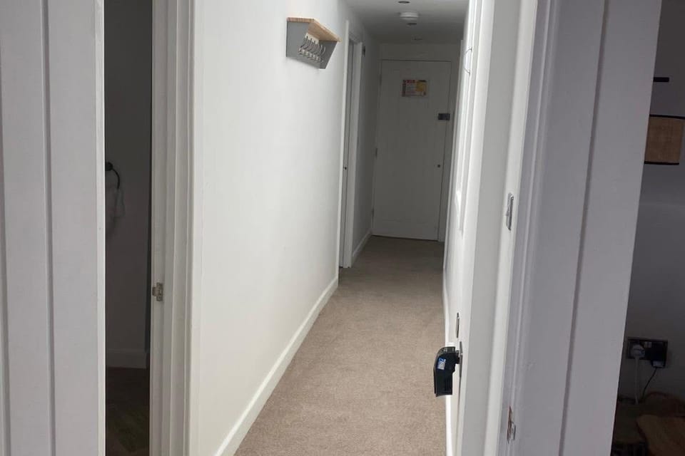 Bright central hallway connecting all rooms — a warm welcome as you step into your holiday home.