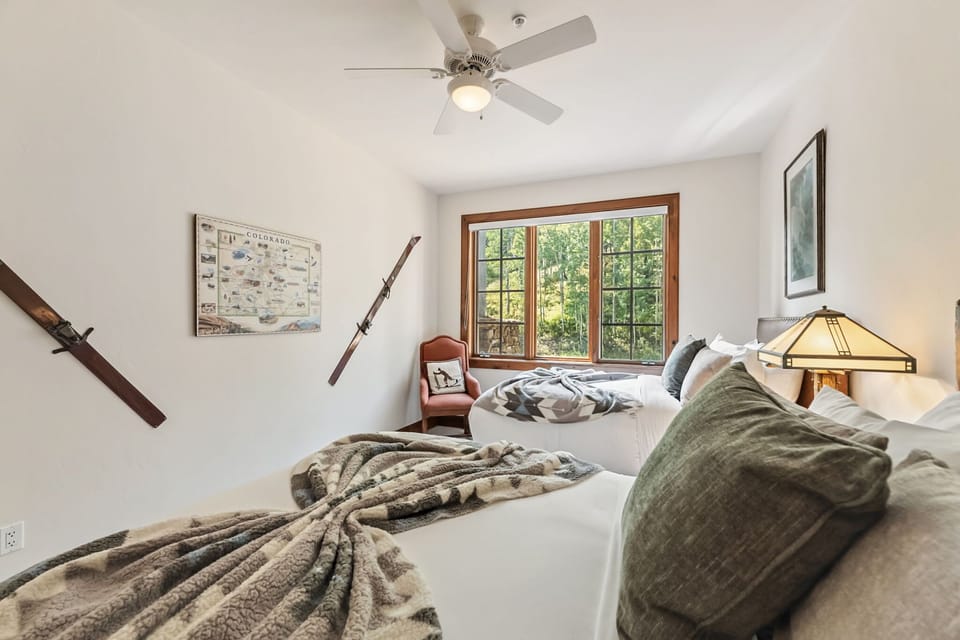 Bedroom 3: 2 full beds, large closet with shelving & drawers, ski trail & forest views