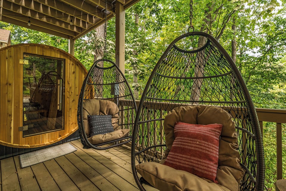 Unwind in these cozy swinging chairs beneath a canopy of lush forest trees.