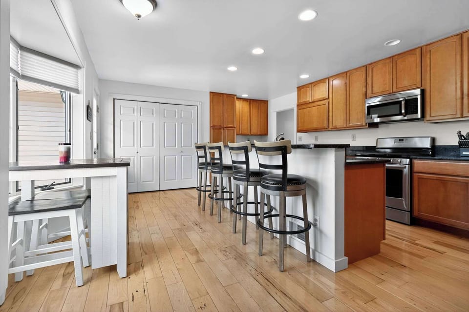 Large stocked kitchen with access to the back deck. 
