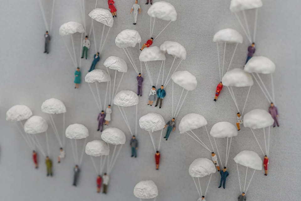 Miniature Figurines With Delicate Seashell Parachutes — A Touch of Coastal Whimsy