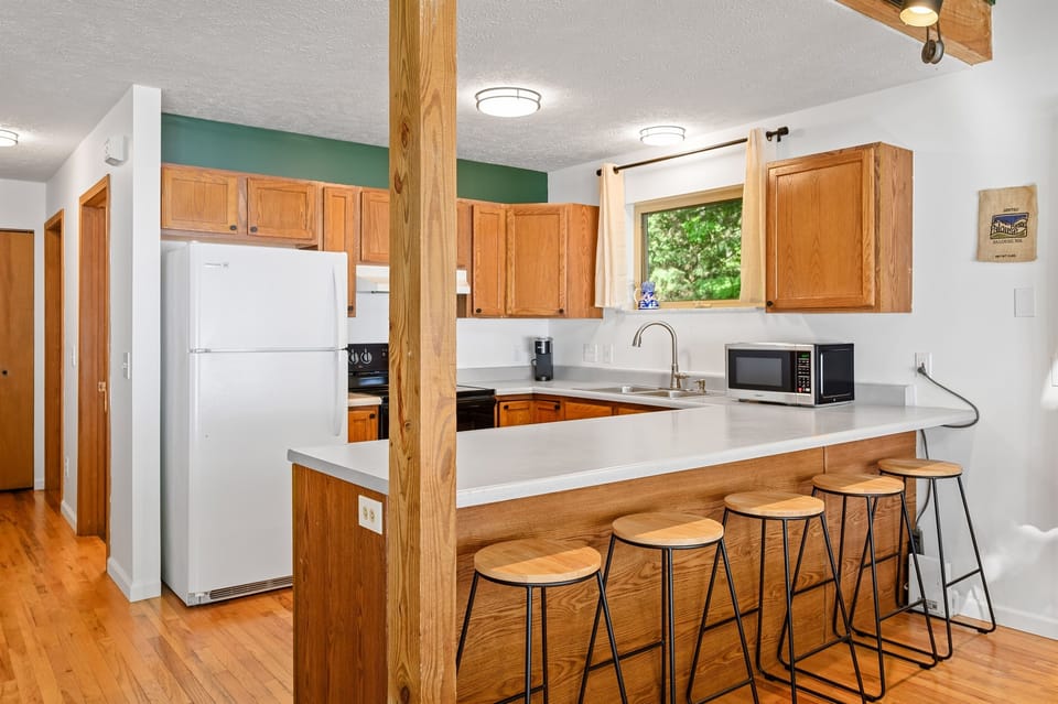 Kitchen with breakfast bar seating and open layout