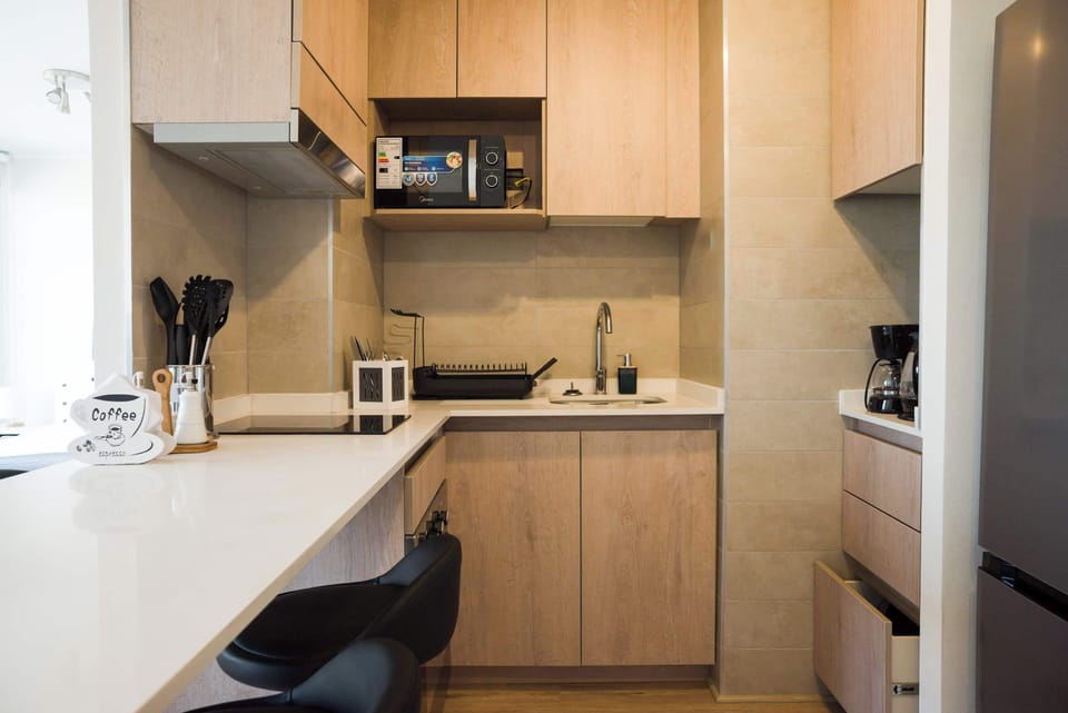Modern and efficient kitchen with all essentials for a comfortable stay in the heart of the city.