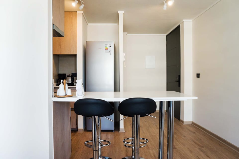 Stylish and modern kitchen with sleek finishes, perfect for preparing meals during your stay.