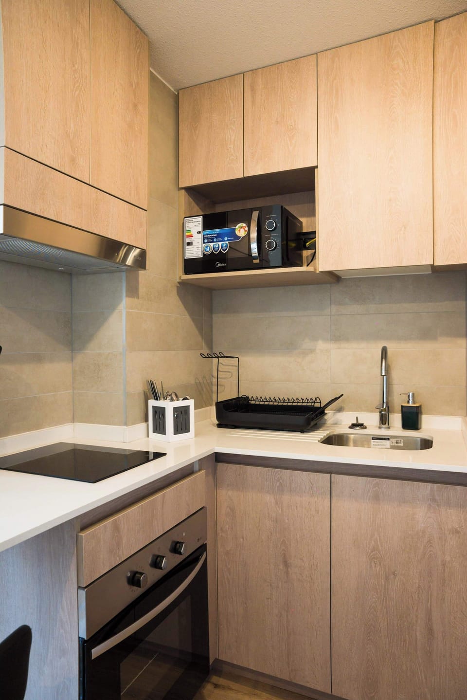 Modern and efficient kitchen with all essentials for a comfortable stay in the heart of the city.