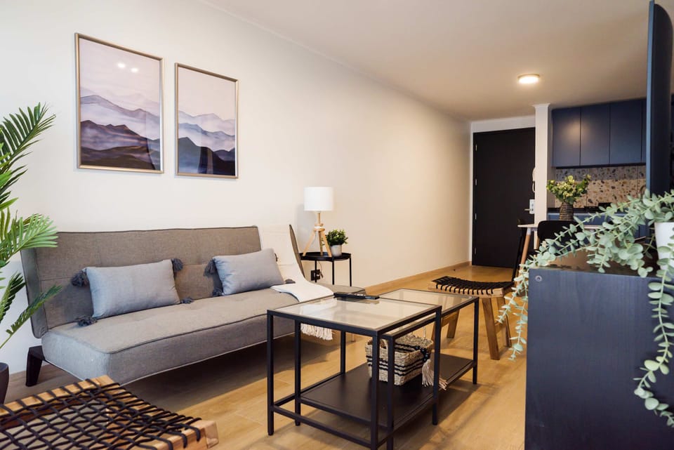 Relax in this stylish living area with chic decor and cozy seating, perfect for unwinding after a day in the city.
