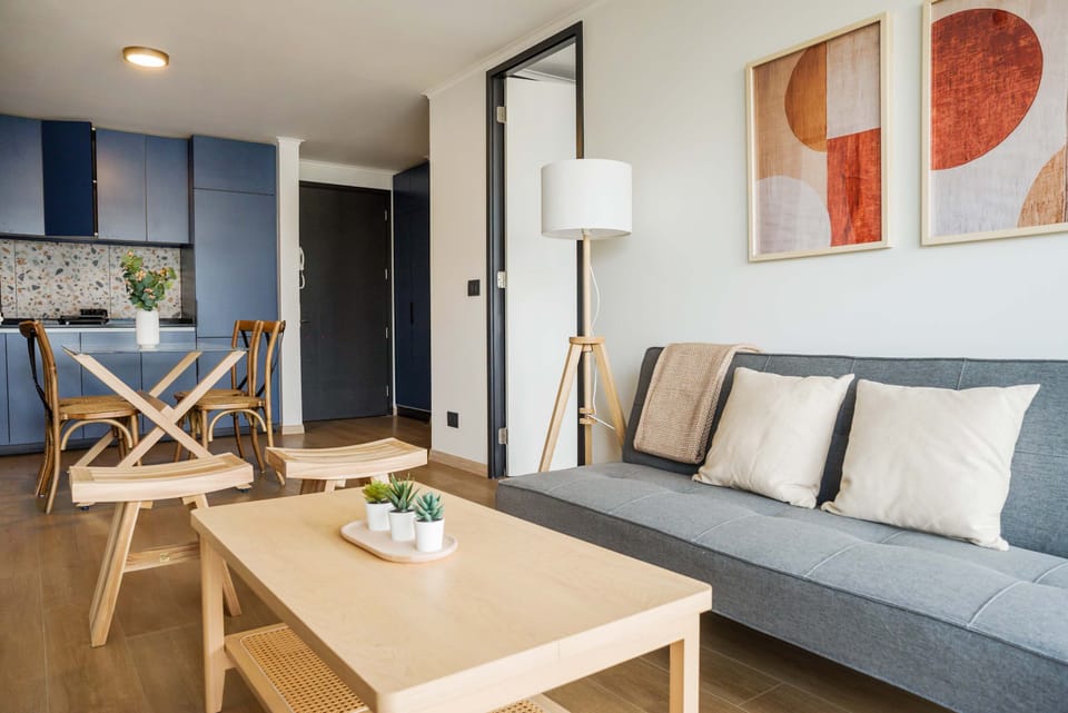 Modern living area with stylish decor and natural light, perfect for relaxation and dining.