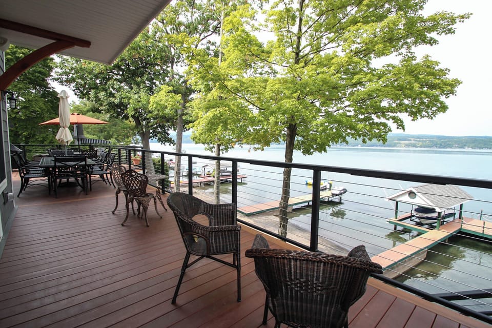 Unwind on the spacious lakeside deck, complete with cozy seating and panoramic water views—perfect for morning coffee or evening cocktails.