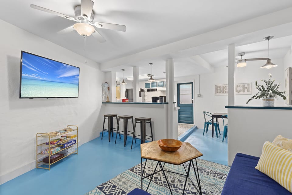 Open-concept living and dining area offering plenty of space to gather, relax, and enjoy meals together in coastal comfort.

