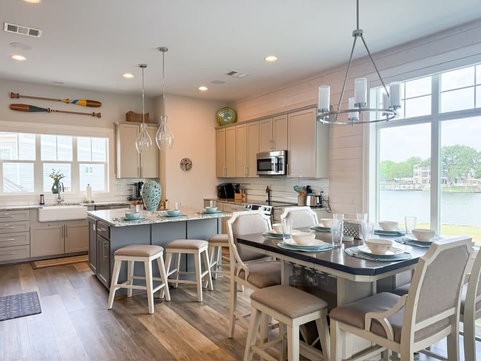 Completely open floor plan with kitchen, dining and living room. Incredible lake views from every window