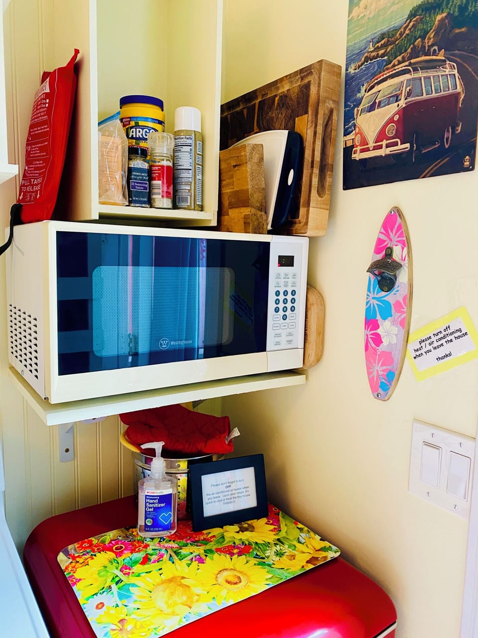 Small fridge, microwave,cooking supplies, dishes, silverware. Sink, water filter
