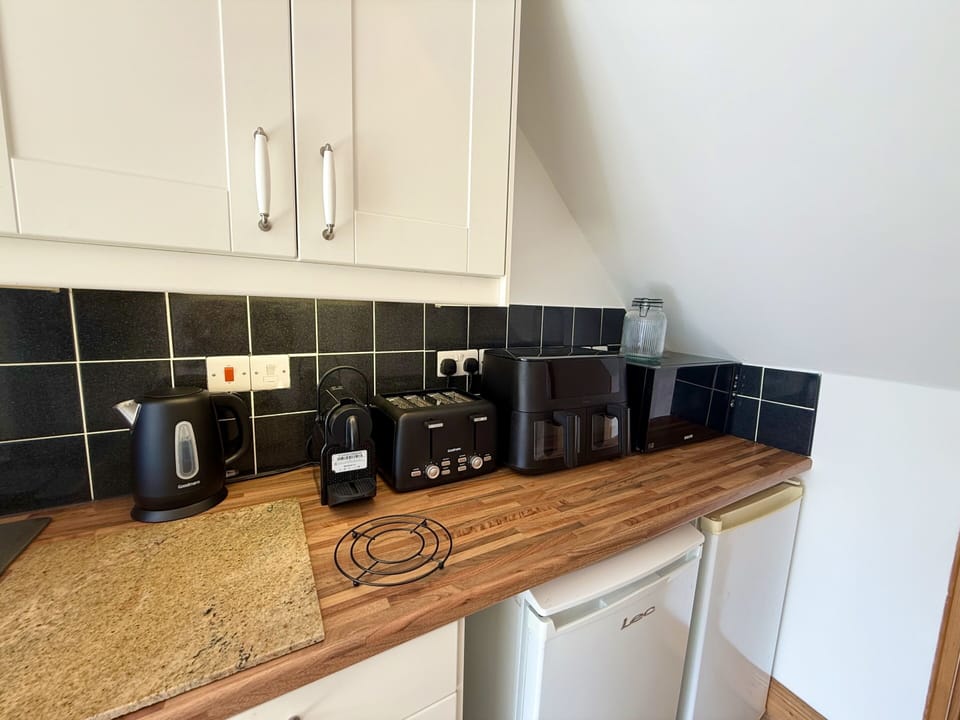 Microwave, Air Fryer, Toaster, COffee maker, and a kettle