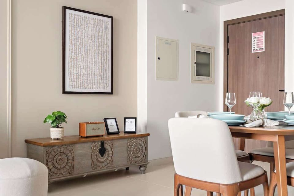 Chic console enhancing the living room decor, topped with a premium Marshall Bluetooth speaker for a blend of style and high-quality sound.