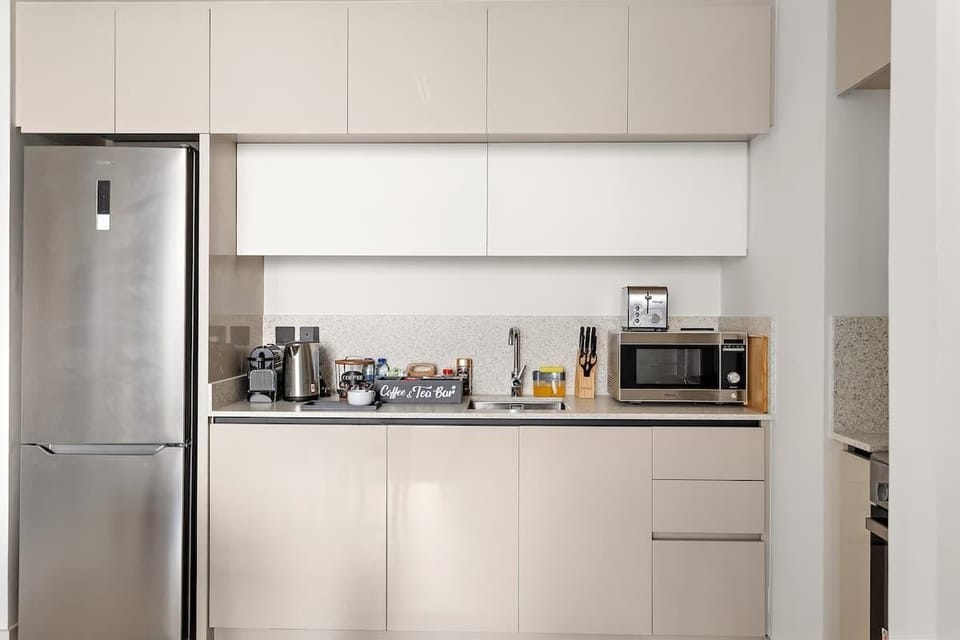 The  kitchen comes fully equipped with all essentials, from cooking utensils, crockery, and cutlery to modern appliances. It includes an electric stove, oven, microwave, kettle, refrigerator, dishwasher, and toaster. 